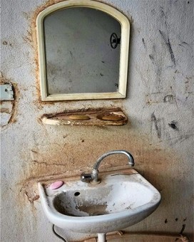 Washbasin and mirror with pink soap